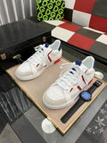 Men's White Low-Top Sneakers with Red and Navy Accents — hero