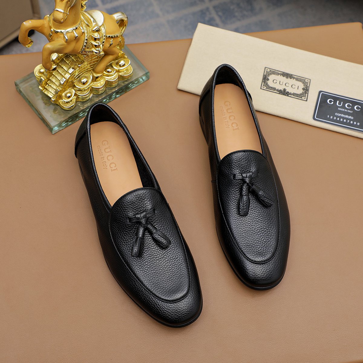 Gucci Textured Tassel Loafers — hero
