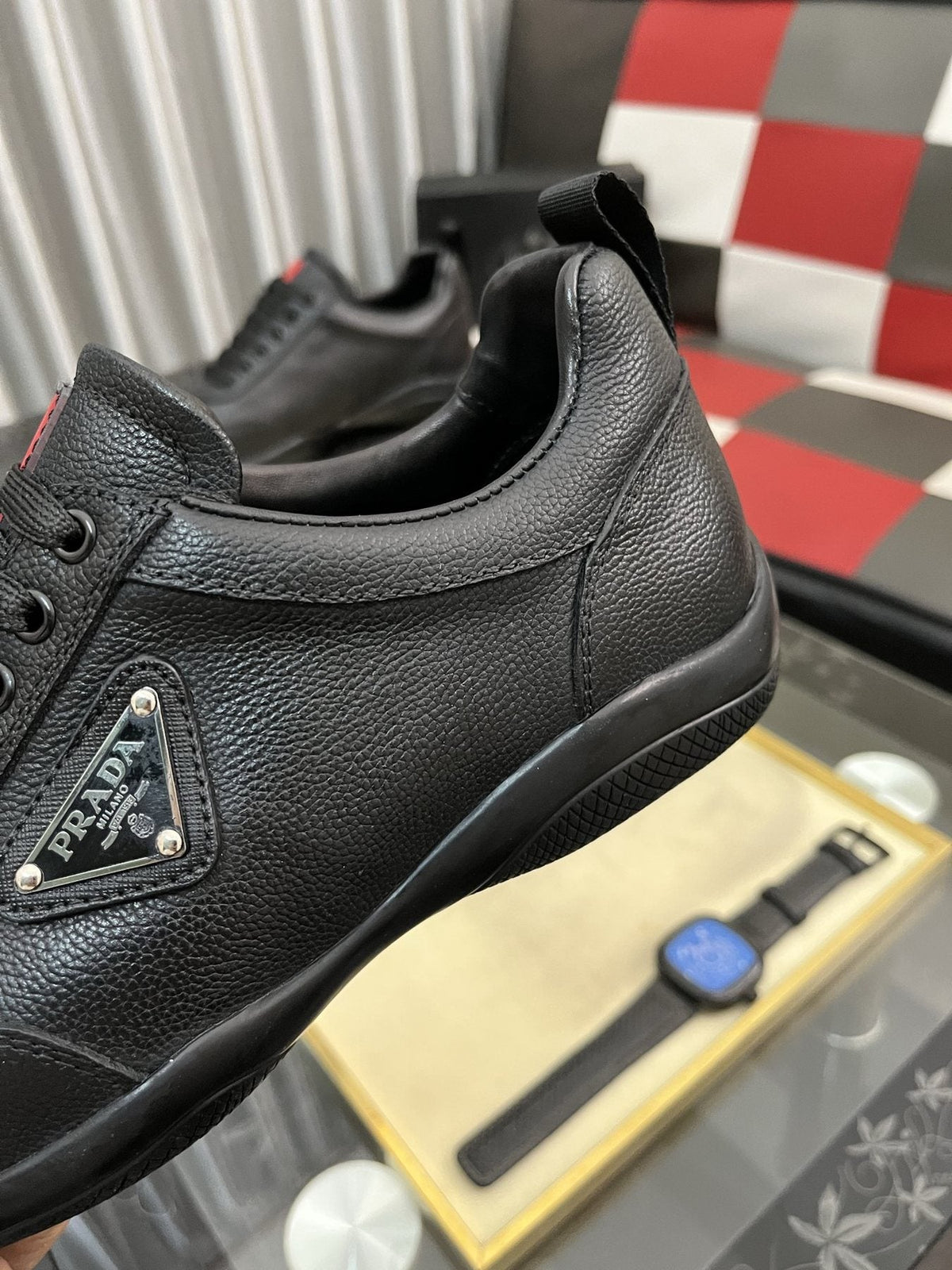 Prada Black Lace-Up Sneakers with Red Tab — detail