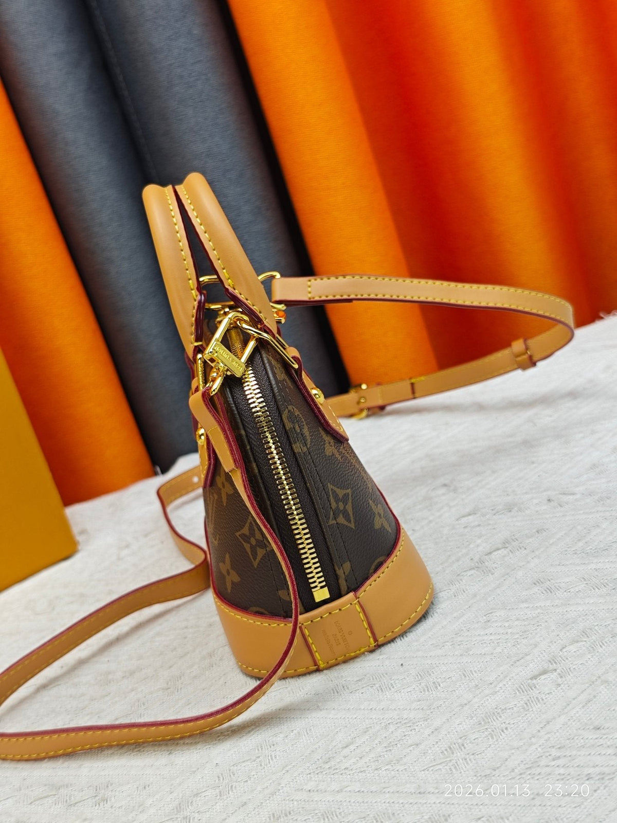 Louis Vuitton Nano Alma Monogram Top-Handle Bag — side