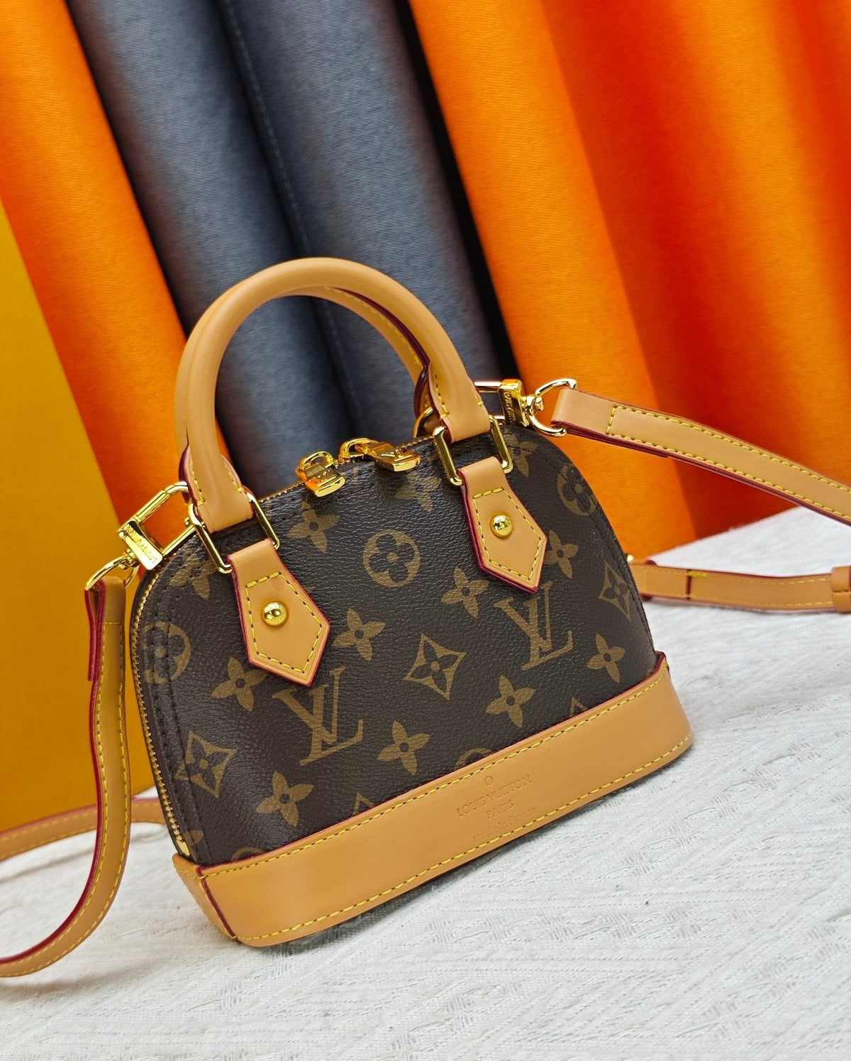 Louis Vuitton Nano Alma Monogram Top-Handle Bag — front