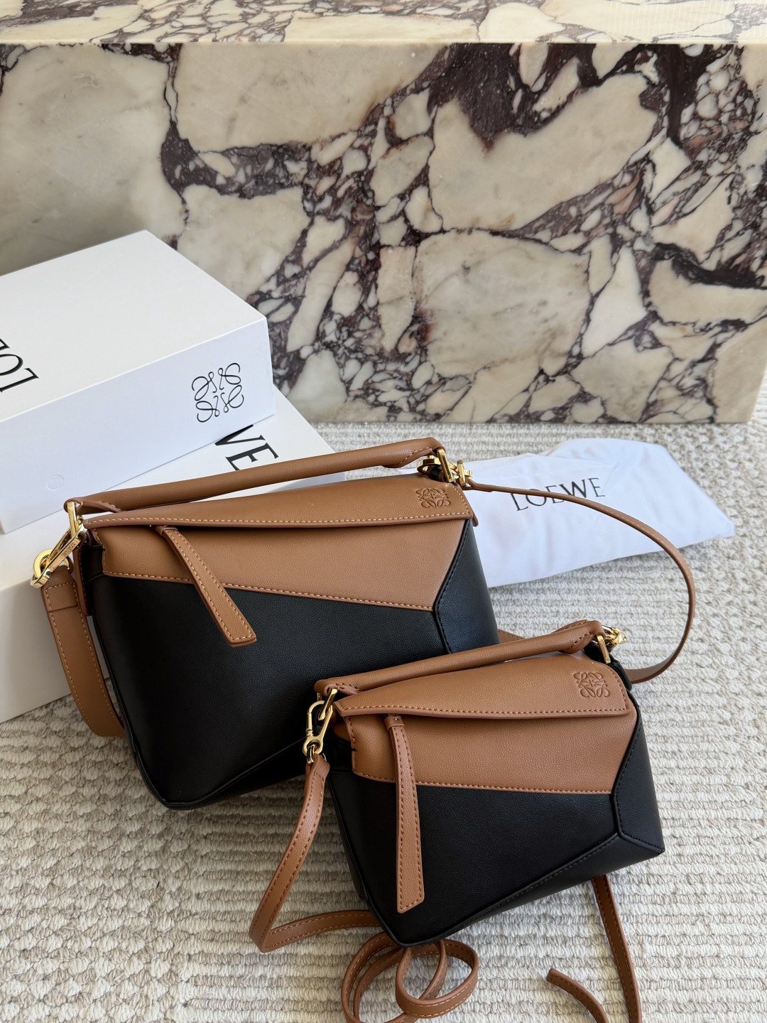 Loewe Puzzle Tan and Black Top-Handle Bag — comparison
